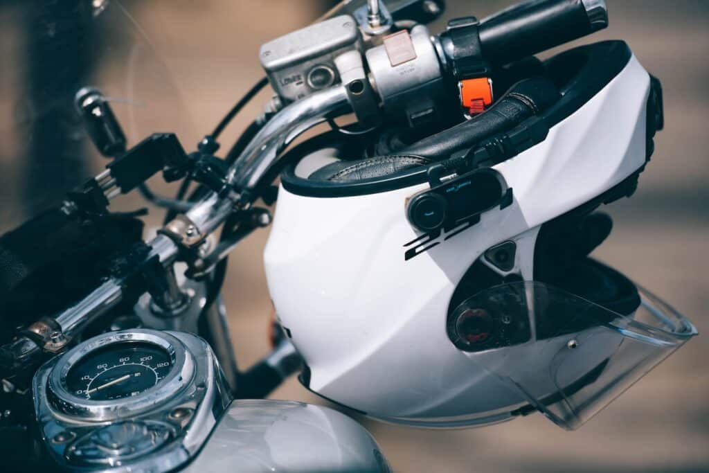New York motorcycle helmet law DOT-approved helmet on motorcycle handlebar injury claim legal concept