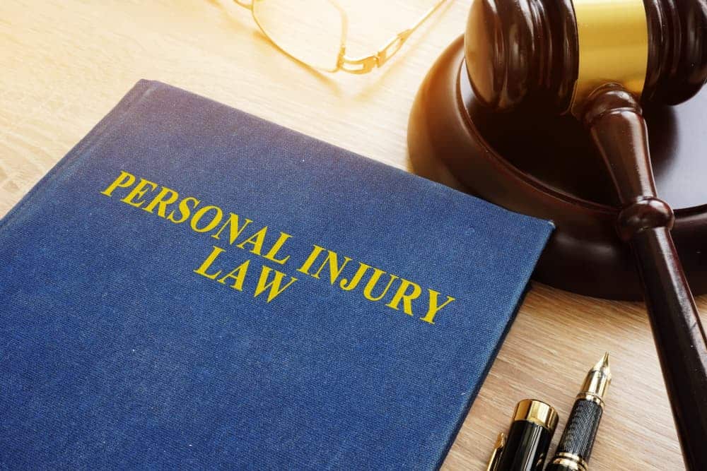 Personal injury law book and gravel
